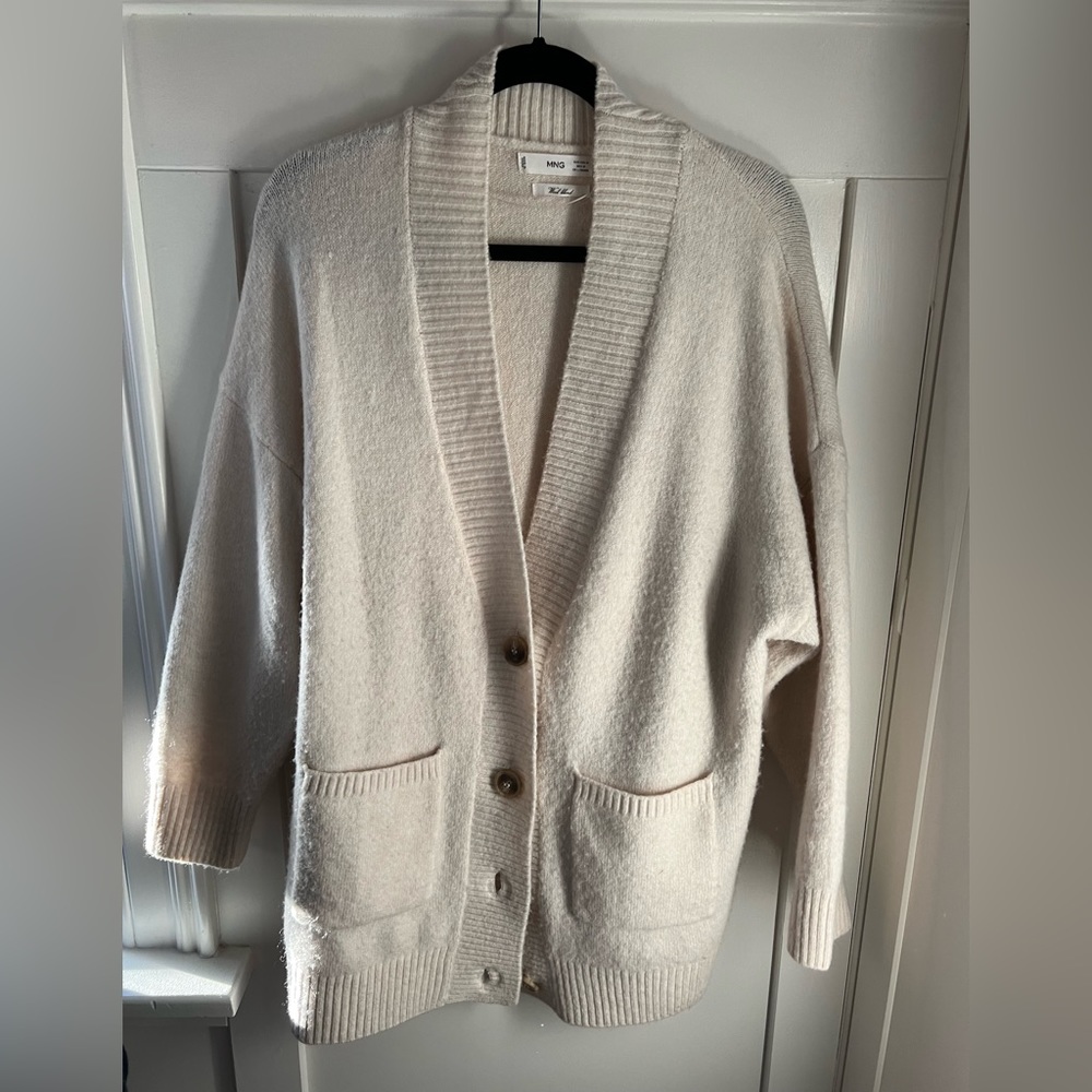 Cream coloured oversized wool blend cardigan with faux wooden buttons. Mango